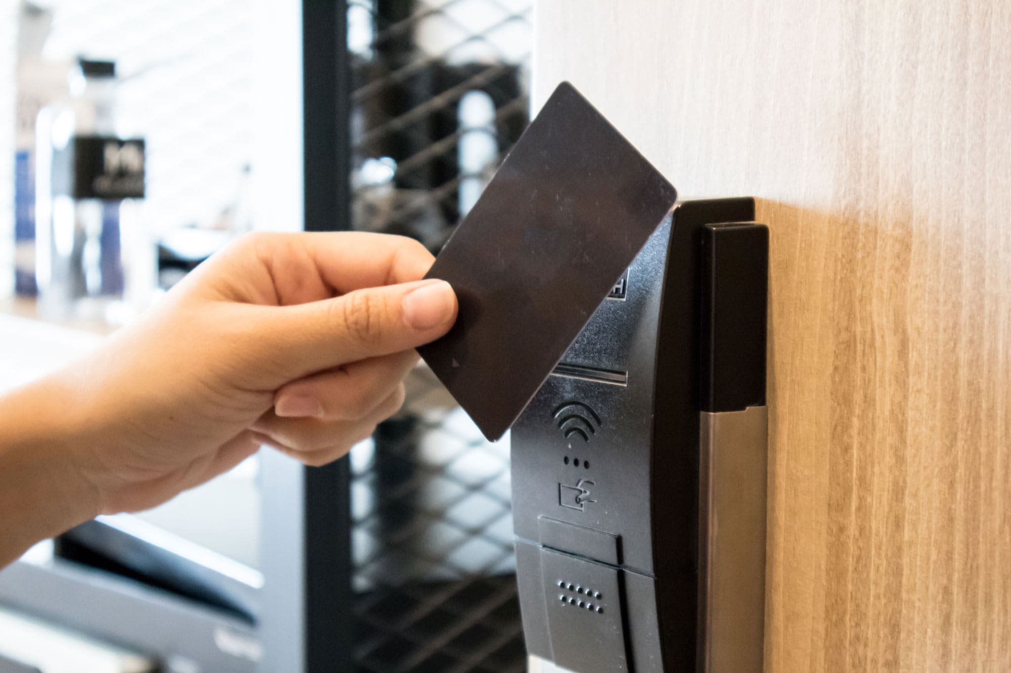 Hand Using Key Card Open Door