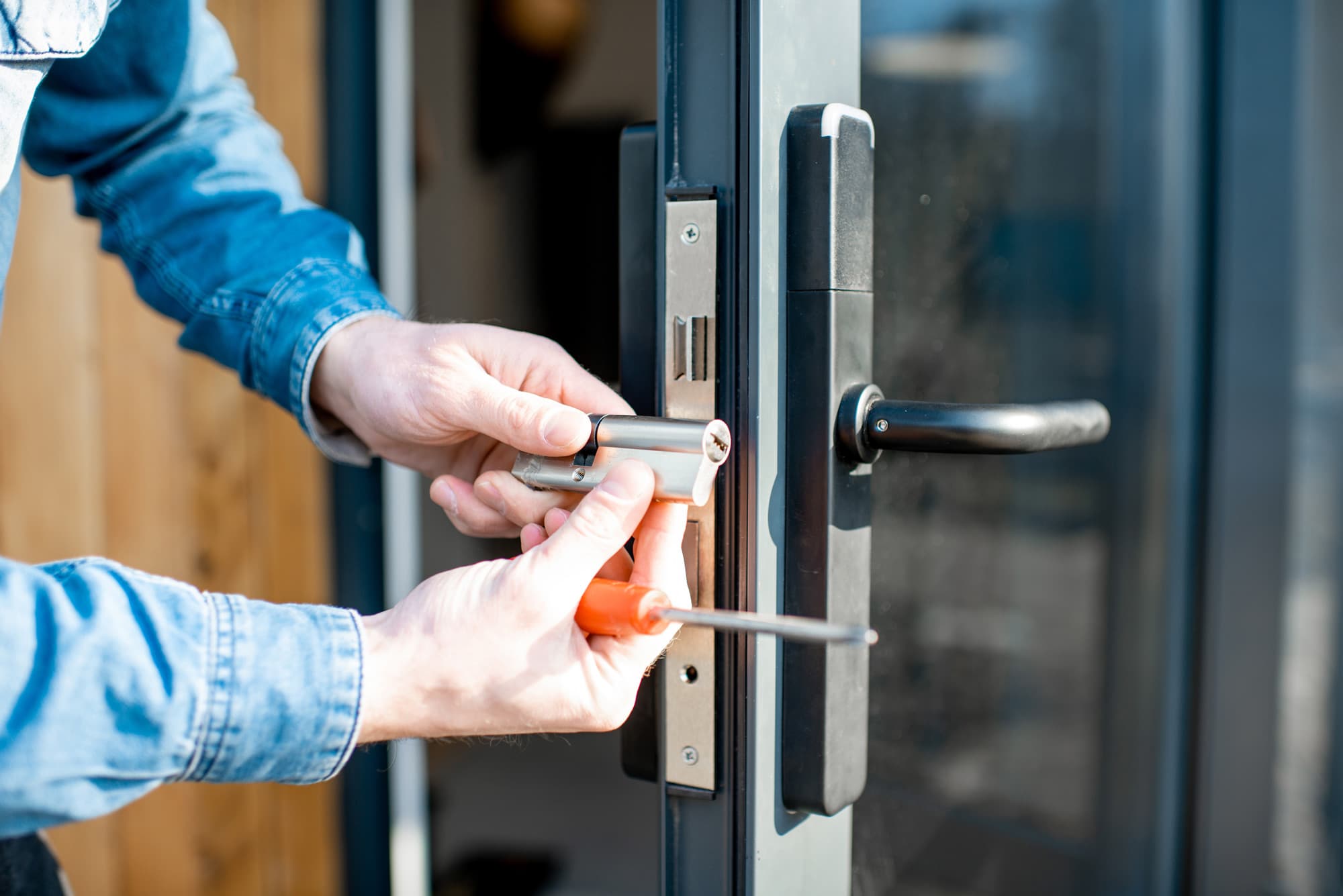 Man Changing Core Door Lock Entrance