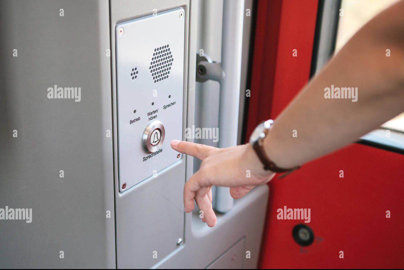 The Person Presses The Button To Call And Talk With The Support Service Of The Train Or Subway The Inscription In German Is Translated As Call Station Operation Service Listen Speak Pt9bt0